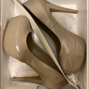 Gently used platform patent taupe color heels